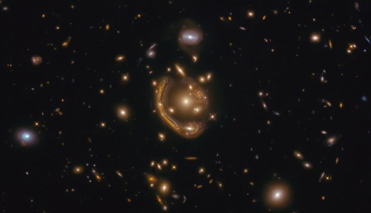   One of the largest and most complete Einstein rings ever seen.  Astronomers call it the "molten ring"

