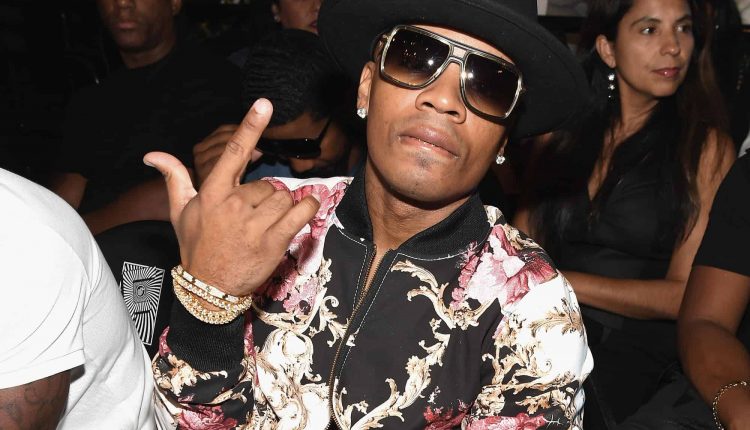 Lagen reveal his new smile after burying his infamous gold teeth

