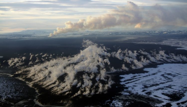 The Holuhraun lava fields with steam rising. Image Credit: Christopher Hamilton.