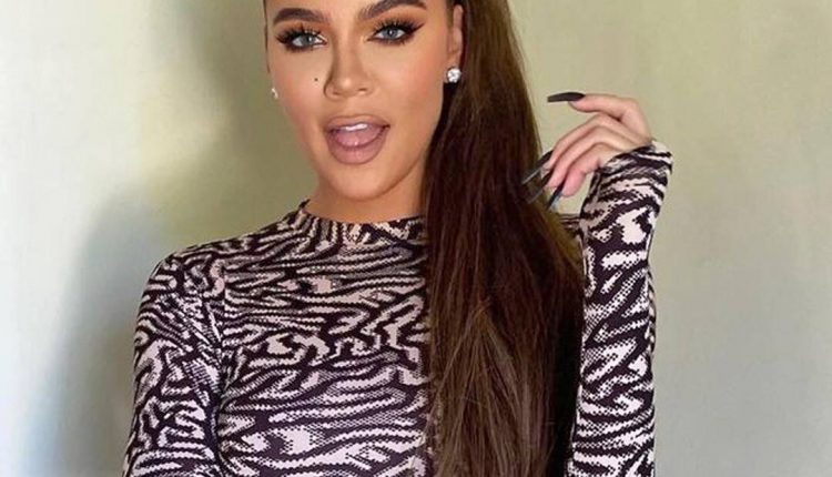 Khloe Kardashian hugs her stretch marks in a bikini photo

