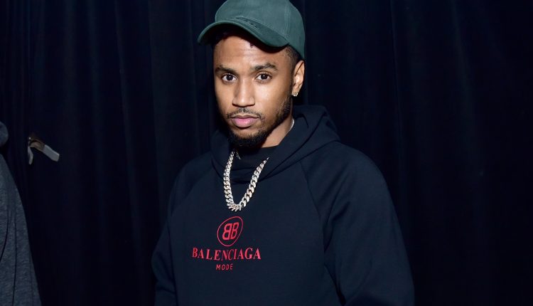 Trey Songz, who is accused of bumping into a woman's car and slapping her hand with his team's car source, denies the claims

