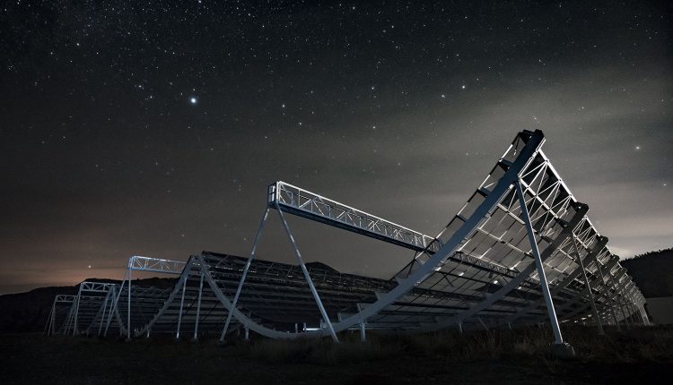 CHIME consists of four metal "half-pipes", each one 100 meters long. Image Credit: CHIME/Andre Renard, Dunlap Institute.