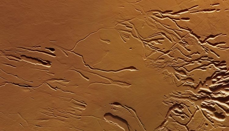 New photos show collapsed chains of craters on a Martian volcano

