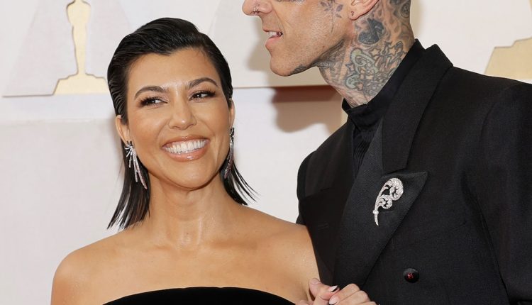 Travis Barker Kisses Pregnant Kourtney Kardashian's Bare Baby Bump