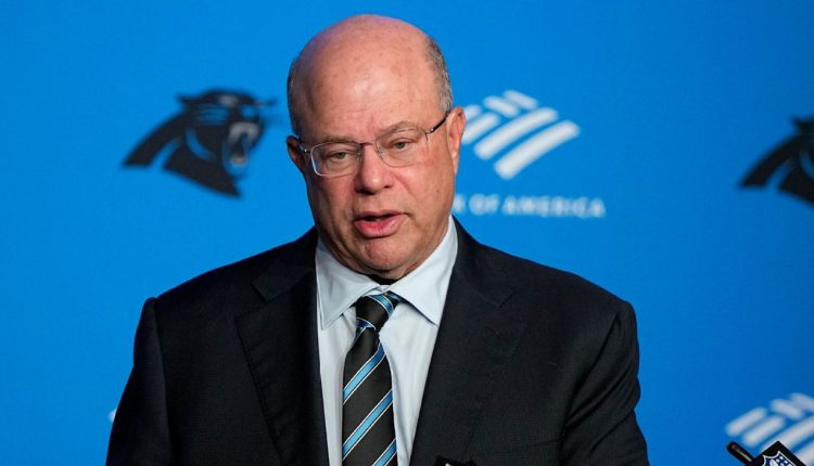Panthers owner David Tepper appears to toss drink at fans